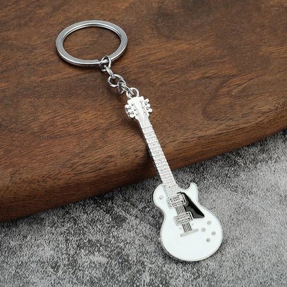 Creative Musical Instrument Pendant Event Gift Bag Pendant Metal Lacquer Guitar Keychain WHITE